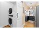Conveniently located laundry area featuring a modern stackable washer and dryer, maximizing space efficiency at 1435 Vine St # 2, Denver, CO 80206