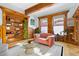 This elegant living room features a built-in bookshelf and plenty of natural light at 1435 Vine St # 2, Denver, CO 80206