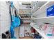 Well-organized walk-in pantry provides ample storage with multiple shelves, cleaning supplies, and household items at 1435 Vine St # 2, Denver, CO 80206