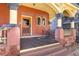 Welcoming porch with ornate columns, dark wood floor, and a vintage door for added appeal at 1435 Vine St # 2, Denver, CO 80206