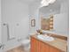 Bathroom with a shower-tub combo, modern vanity, and granite counters at 2680 Blake St # 13, Denver, CO 80205