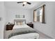 Cozy bedroom featuring a large window, plush carpet, and neutral decor at 2680 Blake St # 13, Denver, CO 80205