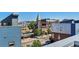 Rooftop view showcasing the surrounding neighborhood, including an unique tower and street activity at 2680 Blake St # 13, Denver, CO 80205