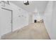 Spacious garage with concrete floors, white walls, and ample storage space for vehicles and belongings at 2680 Blake St # 13, Denver, CO 80205