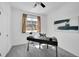 Bright home office with neutral carpet and contemporary furniture at 2680 Blake St # 13, Denver, CO 80205