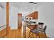 Well-lit kitchen area with modern cabinets, black countertops, stainless steel appliances, and hardwood flooring at 2680 Blake St # 13, Denver, CO 80205