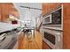 Gourmet kitchen with granite countertops, stainless steel appliances, and custom cabinetry at 2680 Blake St # 13, Denver, CO 80205