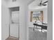 Convenient laundry closet next to a carpeted home office at 2680 Blake St # 13, Denver, CO 80205