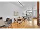 Bright living room featuring modern decor, a dining area, and access to the outdoor living area at 2680 Blake St # 13, Denver, CO 80205