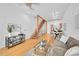 Bright living room featuring hardwood floors, modern staircase, and stylish decor at 2680 Blake St # 13, Denver, CO 80205