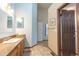 Comfortable bathroom featuring a sink vanity with granite countertops, tiled flooring, and modern fixtures at 5555 E Briarwood Ave # 706, Centennial, CO 80122