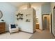 Bedroom featuring a comfortable chair, a neutral color scheme, and wall accents at 5555 E Briarwood Ave # 706, Centennial, CO 80122