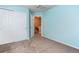 Bright bedroom featuring an egress window, neutral color palette and roomy closet space at 5555 E Briarwood Ave # 706, Centennial, CO 80122