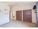 Spacious bedroom features large closets, neutral carpet, and ensuite entry to bathroom at 5555 E Briarwood Ave # 706, Centennial, CO 80122