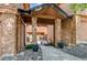 Inviting entrance with brick pillars and potted plants, leading to the home at 5555 E Briarwood Ave # 706, Centennial, CO 80122