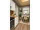 Cozy kitchen with an adjacent dining area, featuring wood floors and modern decor at 5555 E Briarwood Ave # 706, Centennial, CO 80122