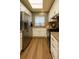 Well-lit kitchen with modern appliances, white cabinets, and stylish countertops at 5555 E Briarwood Ave # 706, Centennial, CO 80122