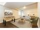 Inviting living room features a comfortable sofa, chair, and a unique foosball table, perfect for relaxation and entertainment at 5555 E Briarwood Ave # 706, Centennial, CO 80122