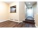 Spacious room featuring wood laminate flooring, neutral-colored walls, and a large picture window at 5555 E Briarwood Ave # 706, Centennial, CO 80122