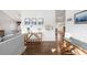 Inviting entryway featuring hardwood floors, neutral walls, and stylish decor and furnishings at 10795 E Powers Dr, Englewood, CO 80111