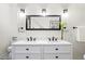 Double vanity bathroom with modern lighting and mirror at 950 Tenderfoot Dr, Larkspur, CO 80118
