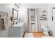 Modern bathroom with white vanity, toilet, and curtains at 950 Tenderfoot Dr, Larkspur, CO 80118