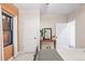 Bedroom with a dresser, mirror, and window with tree views at 950 Tenderfoot Dr, Larkspur, CO 80118