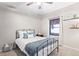 Cozy bedroom with a metal bed frame and window views at 950 Tenderfoot Dr, Larkspur, CO 80118