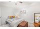 Bedroom with a striped bedspread and wicker storage at 950 Tenderfoot Dr, Larkspur, CO 80118