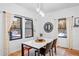 Bright dining area with large windows and modern dining table at 950 Tenderfoot Dr, Larkspur, CO 80118