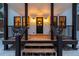 Inviting front porch with black railings and a wreath on the door at 950 Tenderfoot Dr, Larkspur, CO 80118