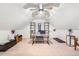 Bright home office features a large desk, shelving, and carpeted flooring at 950 Tenderfoot Dr, Larkspur, CO 80118
