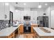 Modern kitchen with light cabinets, quartz counters, and stainless steel appliances at 950 Tenderfoot Dr, Larkspur, CO 80118