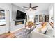 Living room with large windows, fireplace, and comfortable seating at 950 Tenderfoot Dr, Larkspur, CO 80118