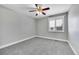 Comfortable bedroom with neutral carpet, shuttered window providing ample natural light at 19731 E 40Th Ave, Denver, CO 80249