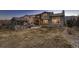 Expansive backyard featuring a covered patio, outdoor kitchen, and lush lawn, ideal for relaxation and recreation at 2618 S Kilmer Ct, Denver, CO 80228