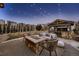 Backyard patio with stone fireplace, perfect for outdoor entertaining with friends and Gathering at 2618 S Kilmer Ct, Denver, CO 80228