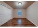 This bedroom features a spacious closet and a window for plenty of natural light at 2618 S Kilmer Ct, Denver, CO 80228