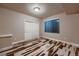 This inviting bedroom features stylish floors and sliding closet doors, creating a cozy retreat at 2618 S Kilmer Ct, Denver, CO 80228
