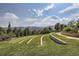 Beautifully landscaped community lawn with walking paths and seating areas, offering a serene and relaxing atmosphere at 2618 S Kilmer Ct, Denver, CO 80228
