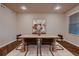 Charming dining room with modern lighting, stylish table and chairs at 2618 S Kilmer Ct, Denver, CO 80228