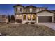 Charming home featuring a covered porch with stone accents and a two-car garage at 2618 S Kilmer Ct, Denver, CO 80228
