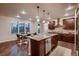Modern kitchen featuring a large island, stainless steel dishwasher, and open layout with a breakfast nook at 2618 S Kilmer Ct, Denver, CO 80228
