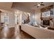 Comfortable living room features a stone fireplace and hardwood floors, with staircase view at 2618 S Kilmer Ct, Denver, CO 80228