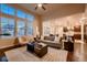 Bright living room with large windows and open floor plan, hardwood floors at 2618 S Kilmer Ct, Denver, CO 80228