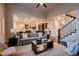 Open concept living room with hardwood flooring and seamless flow into the kitchen at 2618 S Kilmer Ct, Denver, CO 80228
