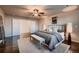 Serene main bedroom with neutral tones, a cozy bed, and ample natural light creating a relaxing retreat at 2618 S Kilmer Ct, Denver, CO 80228