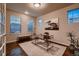 Inviting home office with natural light, stylish desk, and comfortable seating for productive work or study at 2618 S Kilmer Ct, Denver, CO 80228