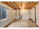 Unfinished basement with exposed piping, ceiling, and walls, and a small window at 21486 E Crestline Ln, Centennial, CO 80015