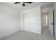 Bright bedroom featuring plush carpeting, neutral walls, and a ceiling fan at 21486 E Crestline Ln, Centennial, CO 80015